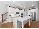 Gourmet kitchen features stainless steel appliances, an oversized island, and hardwood flooring at 1438 Sutters Pond Nw Dr, Kennesaw, GA 30152