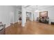 Bright living room boasting hardwood floors and an open floor plan with stylish details at 1438 Sutters Pond Nw Dr, Kennesaw, GA 30152