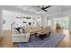 Bright and spacious open floor plan with hardwood flooring and a neutral color palette features a fireplace at 1438 Sutters Pond Nw Dr, Kennesaw, GA 30152