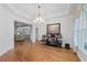 Open living room featuring hardwood floors and a tray ceiling at 1438 Sutters Pond Nw Dr, Kennesaw, GA 30152