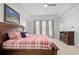 Bright, spacious main bedroom with carpet, ceiling fan, and neutral walls at 1438 Sutters Pond Nw Dr, Kennesaw, GA 30152