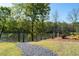 Picturesque pond and trail with a serene view of the water, ideal for nature lovers at 1438 Sutters Pond Nw Dr, Kennesaw, GA 30152