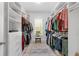 Walk-in closet with ample shelving and storage space for organized wardrobes at 1438 Sutters Pond Nw Dr, Kennesaw, GA 30152