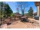 Spacious back deck with outdoor dining set, wood railings, and a clear view of the backyard at 317 Vista Lake Dr, Suwanee, GA 30024