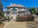 Expansive backyard featuring a patio, well-maintained lawn, and mature landscaping for outdoor enjoyment at 317 Vista Lake Dr, Suwanee, GA 30024