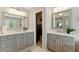 Bathroom highlighting dual vanities, modern fixtures, and access to a walk-in closet at 317 Vista Lake Dr, Suwanee, GA 30024