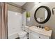 Cozy bathroom with white tile and shower-tub combination and a neutral-toned shower curtain at 317 Vista Lake Dr, Suwanee, GA 30024