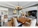Cozy dining room with wainscoting detail offering an elegant and comfortable space at 317 Vista Lake Dr, Suwanee, GA 30024