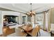 Open dining area with hardwood floors and seamless access to the living spaces at 317 Vista Lake Dr, Suwanee, GA 30024