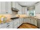 Gourmet kitchen featuring granite countertops, stainless steel appliances, and custom cabinetry at 317 Vista Lake Dr, Suwanee, GA 30024
