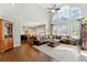 Inviting living room with soaring ceilings, a grand window display, and open floor plan at 317 Vista Lake Dr, Suwanee, GA 30024