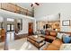 Spacious living room with high ceiling and open layout to the kitchen, featuring a large leather sectional at 317 Vista Lake Dr, Suwanee, GA 30024