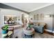 Open-concept living room with elegant furnishings and seamless flow to the dining area at 317 Vista Lake Dr, Suwanee, GA 30024