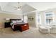 Spacious main bedroom with tray ceiling, large windows with natural light, and a sitting area at 317 Vista Lake Dr, Suwanee, GA 30024