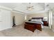 Main bedroom featuring plush carpet, tray ceilings, and ample space for relaxation at 317 Vista Lake Dr, Suwanee, GA 30024