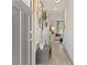 Inviting entryway with hardwood floors, elegant decor, and a view into the open living space at 413 Brooch Way, Stockbridge, GA 30281