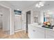 Bright bathroom with glass shower and white vanity at 425 Brooch Way, Stockbridge, GA 30281