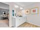 Bright bathroom with double vanity, mirror and warm wood flooring at 425 Brooch Way, Stockbridge, GA 30281