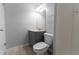Bathroom featuring single vanity, framed mirror and standard toilet at 530 Bell Se Rd, Conyers, GA 30094