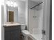 Bathroom featuring single vanity, framed mirror, standard toilet and shower stall at 530 Bell Se Rd, Conyers, GA 30094