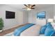 Modern bedroom showing two flat screen tvs, and a ceiling fan at 530 Bell Se Rd, Conyers, GA 30094