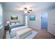 Cozy bedroom with a ceiling fan, modern furnishings and walk in closet at 530 Bell Se Rd, Conyers, GA 30094