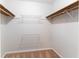 Walk-in closet featuring shelving and carpet flooring at 530 Bell Se Rd, Conyers, GA 30094