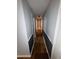 Hallway with hardwood flooring, base molding, and neutral-toned walls offers access to rooms at 530 Bell Se Rd, Conyers, GA 30094