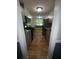Galley kitchen with stainless steel appliances, granite countertops, updated cabinetry, and tile backsplash at 530 Bell Se Rd, Conyers, GA 30094