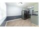 Bright kitchen with stainless steel refrigerator, tile floors, and updated cabinets at 530 Bell Se Rd, Conyers, GA 30094