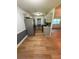 Open-concept kitchen featuring stainless steel appliances, updated cabinetry, and granite countertops at 530 Bell Se Rd, Conyers, GA 30094