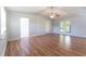 Spacious living room featuring hardwood floors and French doors leading to the backyard at 530 Bell Se Rd, Conyers, GA 30094