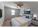 Modern main bedroom showcasing a ceiling fan, a window, and an interior design at 530 Bell Se Rd, Conyers, GA 30094