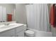 Cozy bathroom with a sink, toilet, vanity, and shower at 1123 Providence Pl, Decatur, GA 30033