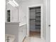 Bright bathroom featuring a large mirror, vanity, and open walk-in closet at 1123 Providence Pl, Decatur, GA 30033