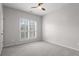 Sun-filled bedroom with shuttered windows and neutral carpet at 1123 Providence Pl, Decatur, GA 30033