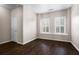 Hardwood bedroom with bright, shuttered windows and closet access at 1123 Providence Pl, Decatur, GA 30033