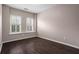 Bedroom with hardwood floors and bright shuttered windows at 1123 Providence Pl, Decatur, GA 30033