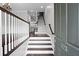 Inviting entryway showcases a staircase with dark wood accents and modern white railings at 1123 Providence Pl, Decatur, GA 30033