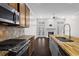 Modern kitchen features stainless steel appliances, granite countertops, and a stylish butcher block island at 1123 Providence Pl, Decatur, GA 30033