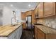View of kitchen with butcher block island, gas range, stainless steel appliances, and cabinets at 1123 Providence Pl, Decatur, GA 30033
