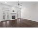Bright living room with a fireplace, ceiling fan, and French doors leading to an outdoor space at 1123 Providence Pl, Decatur, GA 30033