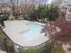 Relaxing community pool area with lounge chairs and a stone fireplace for outdoor enjoyment at 1123 Providence Pl, Decatur, GA 30033