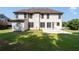 Large backyard with green lawn and concrete patio, surrounded by lush trees for privacy at 2365 Barrington Trace Sw Cir, Atlanta, GA 30331