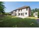 The expansive backyard features lush green grass and a concrete patio, ideal for outdoor enjoyment at 2365 Barrington Trace Sw Cir, Atlanta, GA 30331