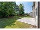 Spacious backyard with green grass and a patio, perfect for outdoor relaxation and entertaining at 2365 Barrington Trace Sw Cir, Atlanta, GA 30331