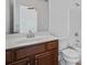 Bathroom with dark wood vanity, white countertop and sink, offering a functional and stylish space at 2365 Barrington Trace Sw Cir, Atlanta, GA 30331