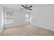 Bright bedroom with two windows, neutral carpet, and white walls creating a serene and inviting atmosphere at 2365 Barrington Trace Sw Cir, Atlanta, GA 30331