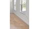 Neutral bedroom features cozy carpeting and ample natural light from two windows, creating a serene atmosphere at 2365 Barrington Trace Sw Cir, Atlanta, GA 30331