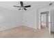 Bedroom with neutral carpet and ceiling fan; a closet and an open doorway that leads to another room at 2365 Barrington Trace Sw Cir, Atlanta, GA 30331